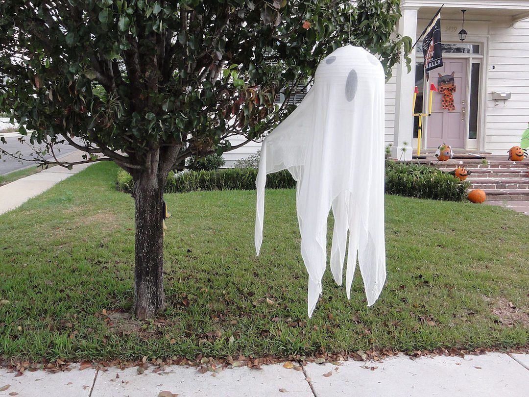 Ghost Halloween Decoration Hanging From a Tree