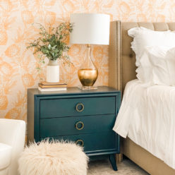 Calypso Wallpaper • Gold wallpaper • Yellow Wallpaper • Pineapple Wallpaper behind a teal bedside dresser