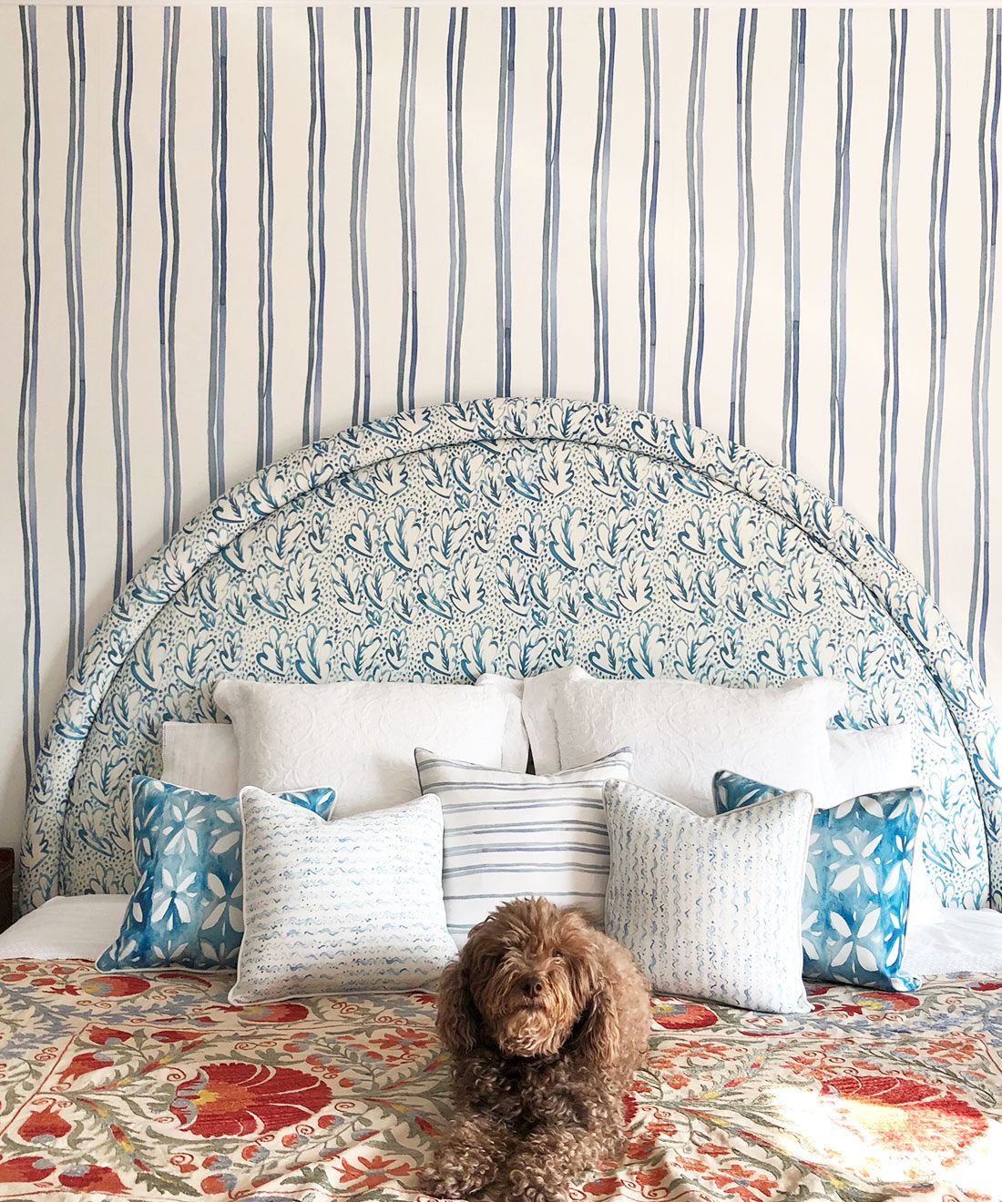 Double Inky Stripe • Striped Wallpaper • Blue Striped Wallpaper Rolls • Georgia MacMillan • Milton & King USA • Bedroom wallpaper showing a bed with a brown dog