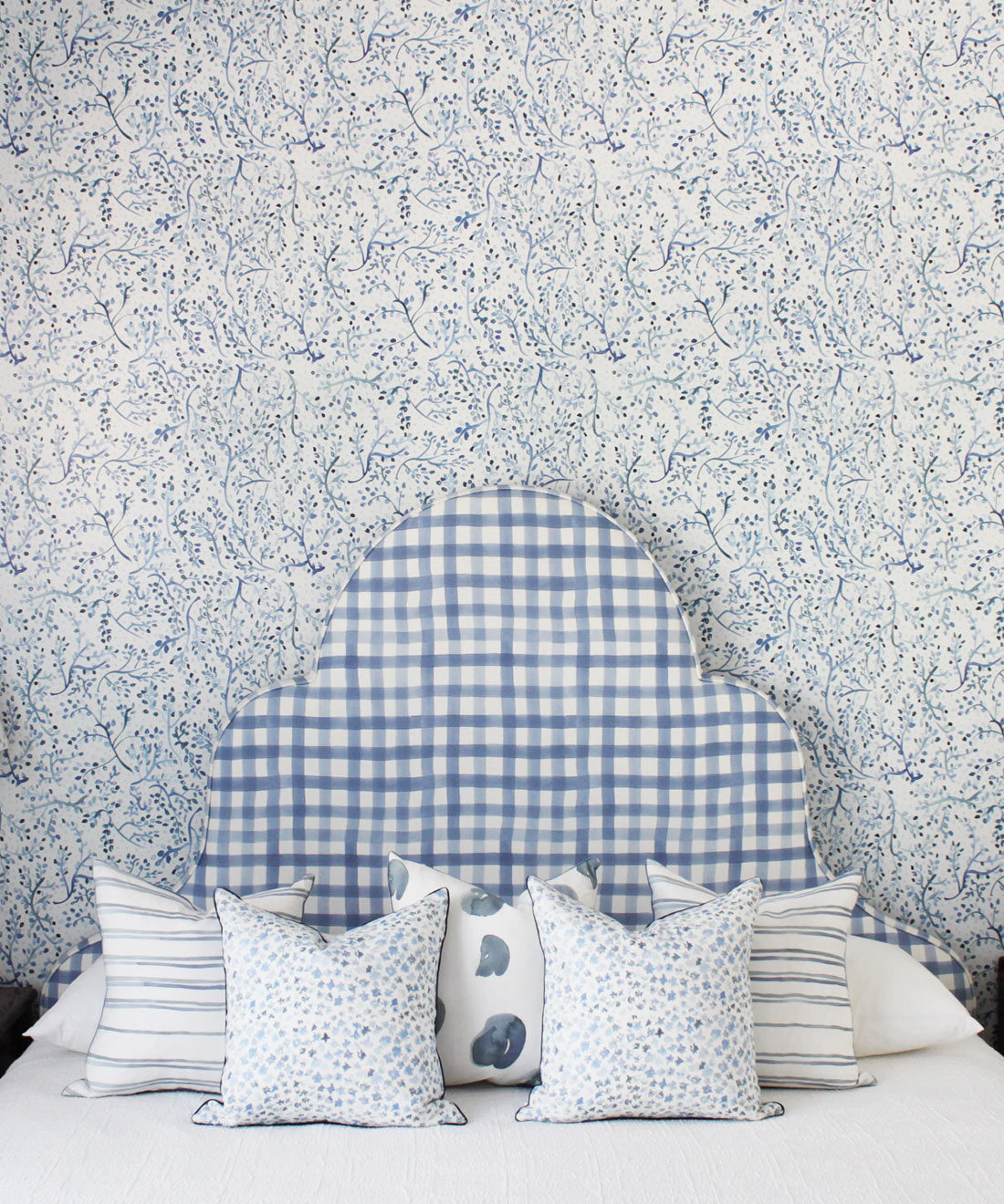 Indigo Garden • Blue Botanical Wallpaper • Floral • Bedroom with plaid blue headboard and white pillows. Milton & King USA