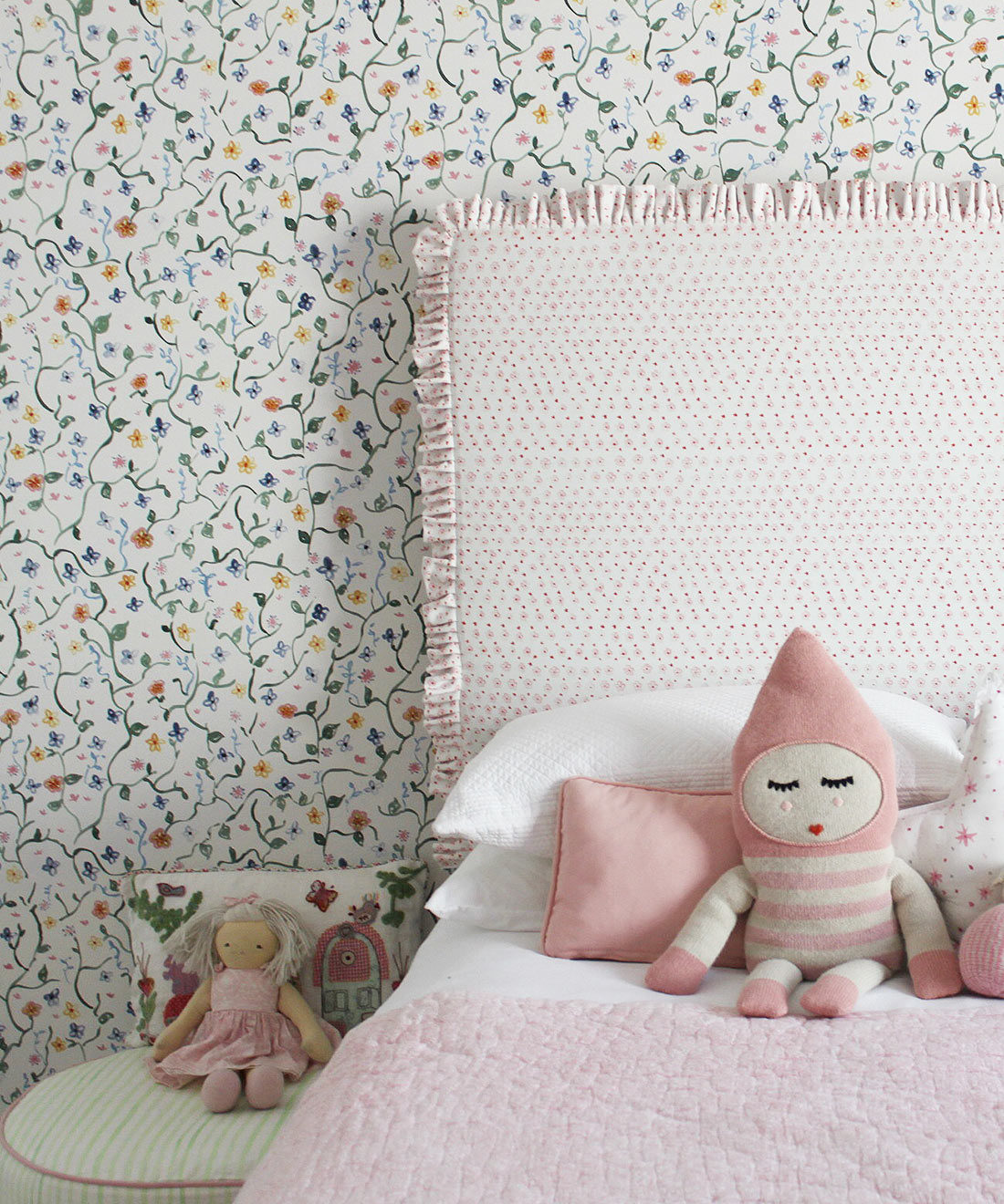 Wild Garden • Dainty Floral Wallpaper • Milton & King USA • Georgia MacMillan • Childrens Wallpaper • Nursery Wallpaper • Bed with pink headboard and pink duvet