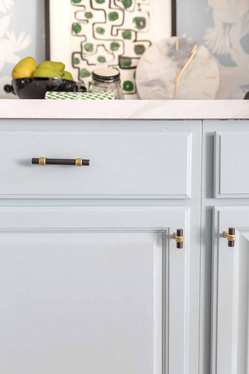 Jewel Marlow Basement Makeover • A kitchen counter top with a black bowl of green pears