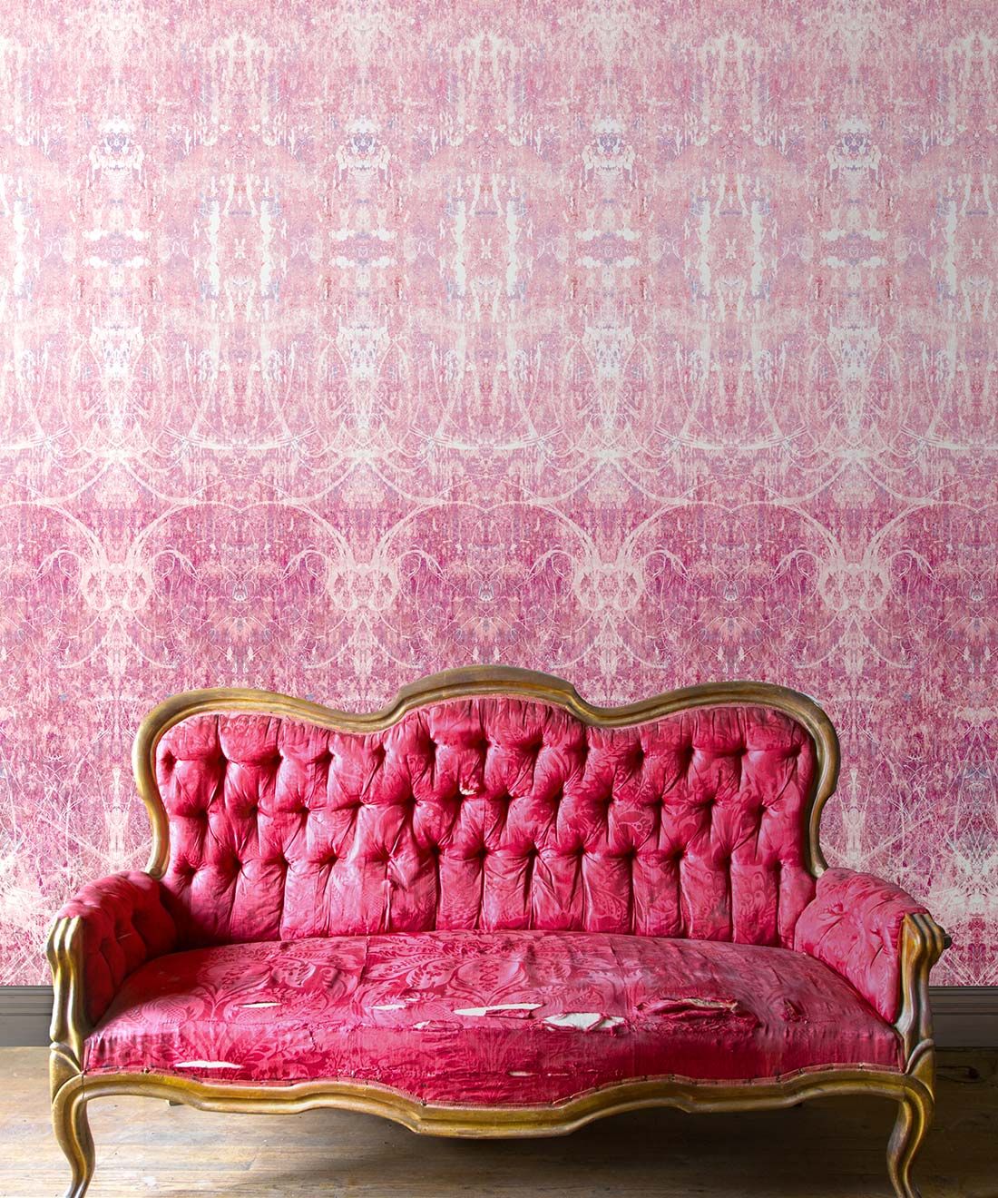 Hori Wallpaper by Simcox • Color Rose • Abstract Wallpaper • insitu with a pink sofa