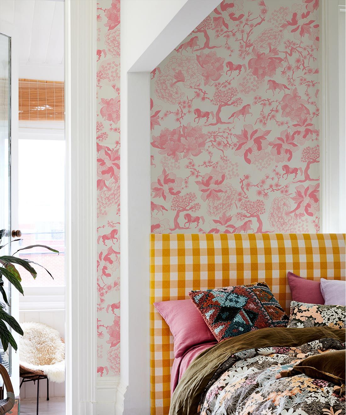 Gallop Wallpaper • Horse Wallpaper • Fleur • Insitu with bed and plaid headboard