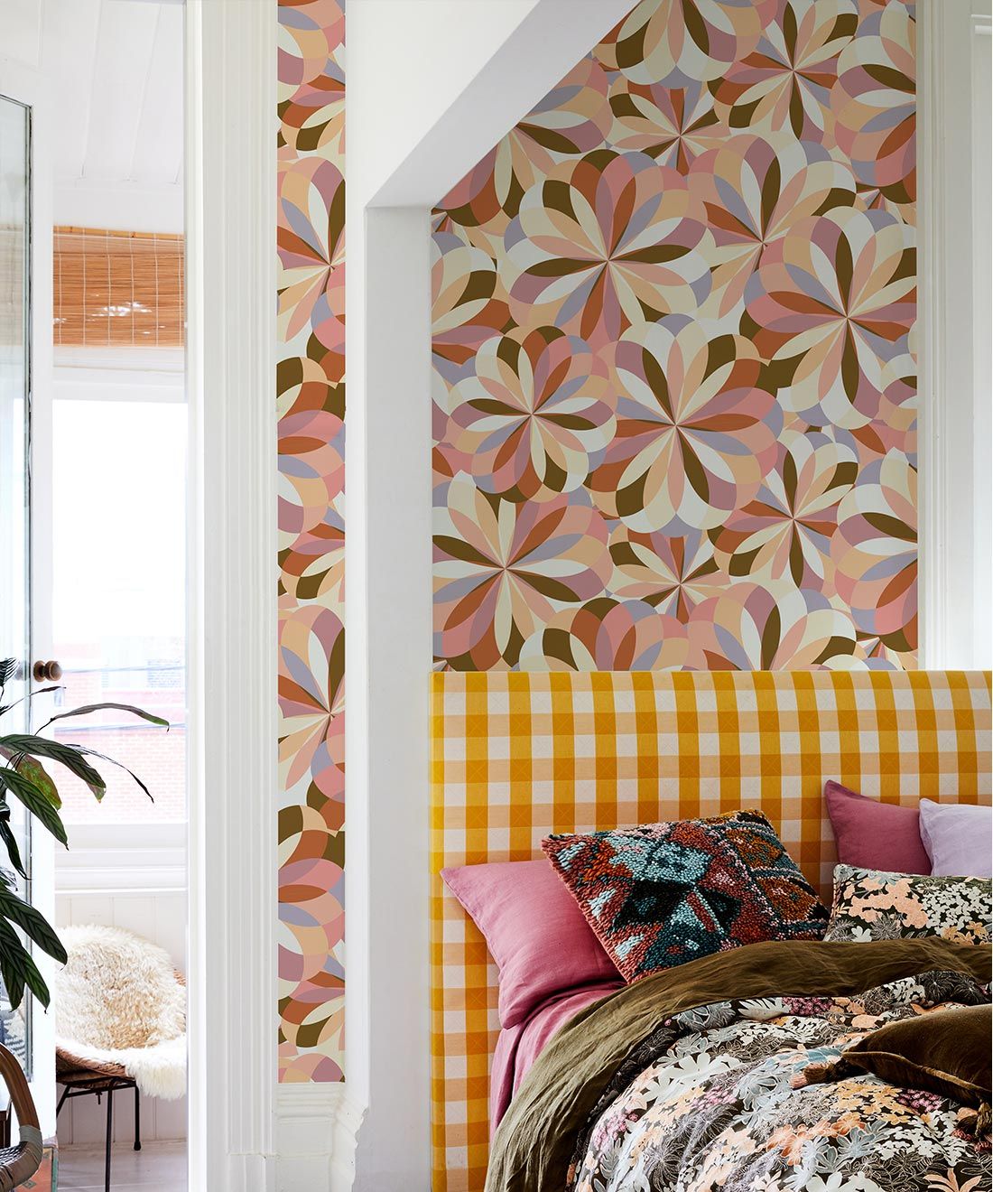 Uncommonly Splendid Wallpaper • Retro Kaleidoscope Wallpaper • Autumn • Insitu with yellow plaid headboard