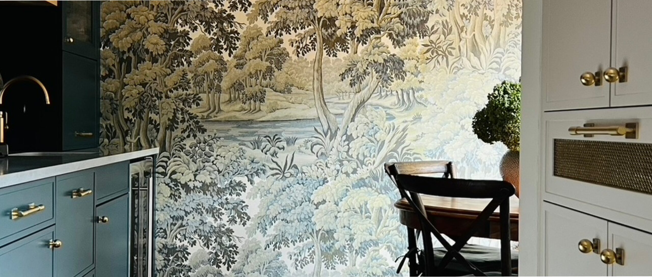 a lush kitchen with a mural