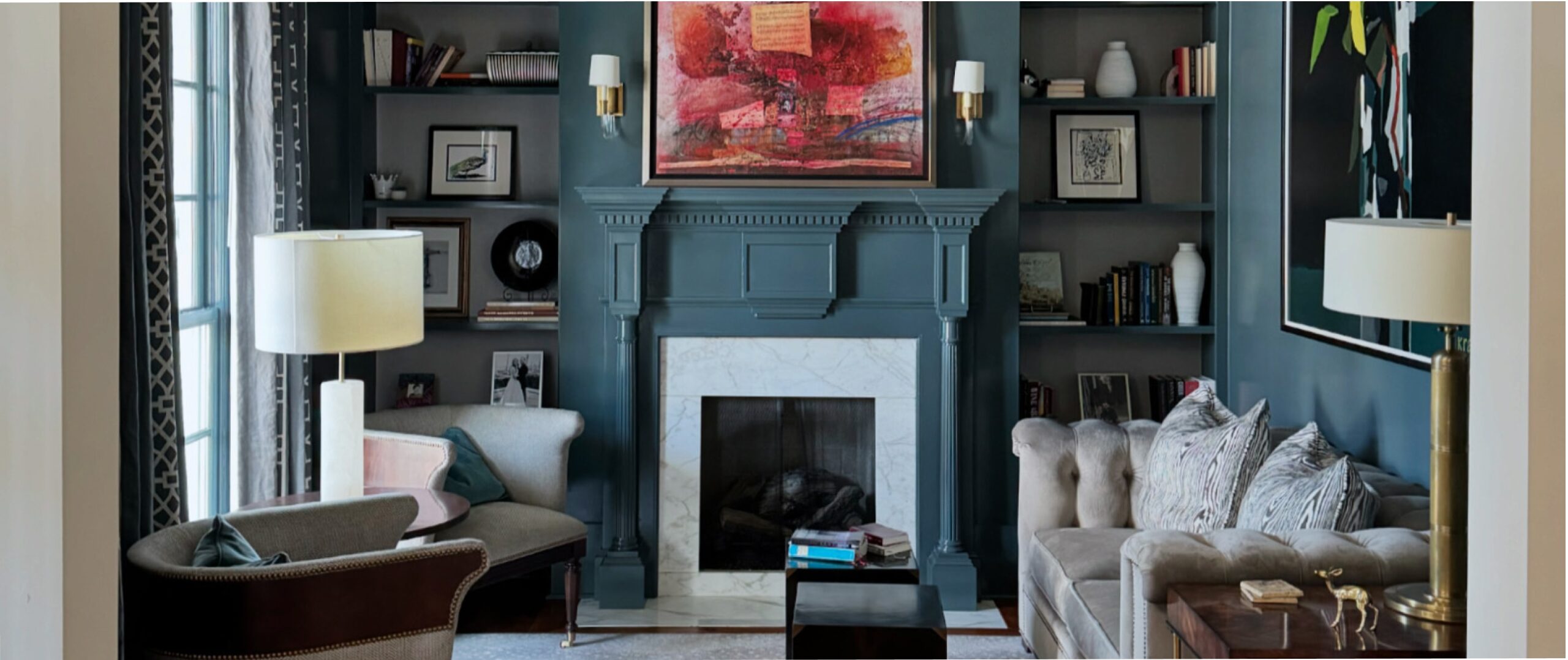 A dark blue classic living room with wall paneling and a fire place
