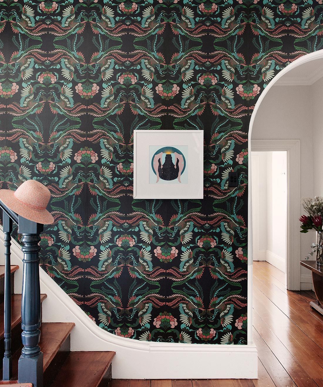 Prancing Peacocks Wallpaper • Fiesta • Insitu with stairs and hat on banister
