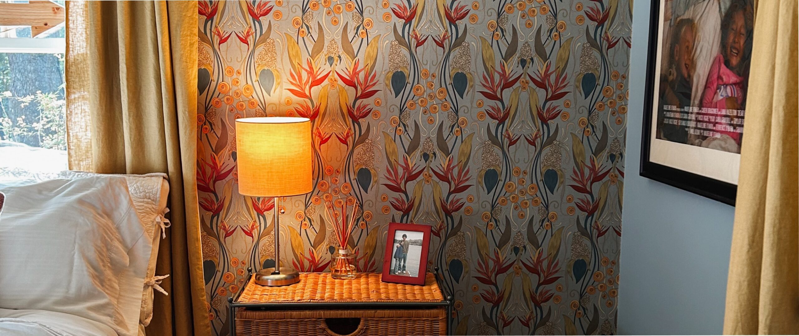 a bedroom with birds of paradise wallpaper
