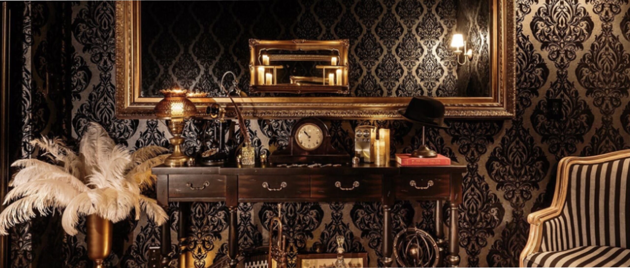 a dark academic room with lots of black and gold