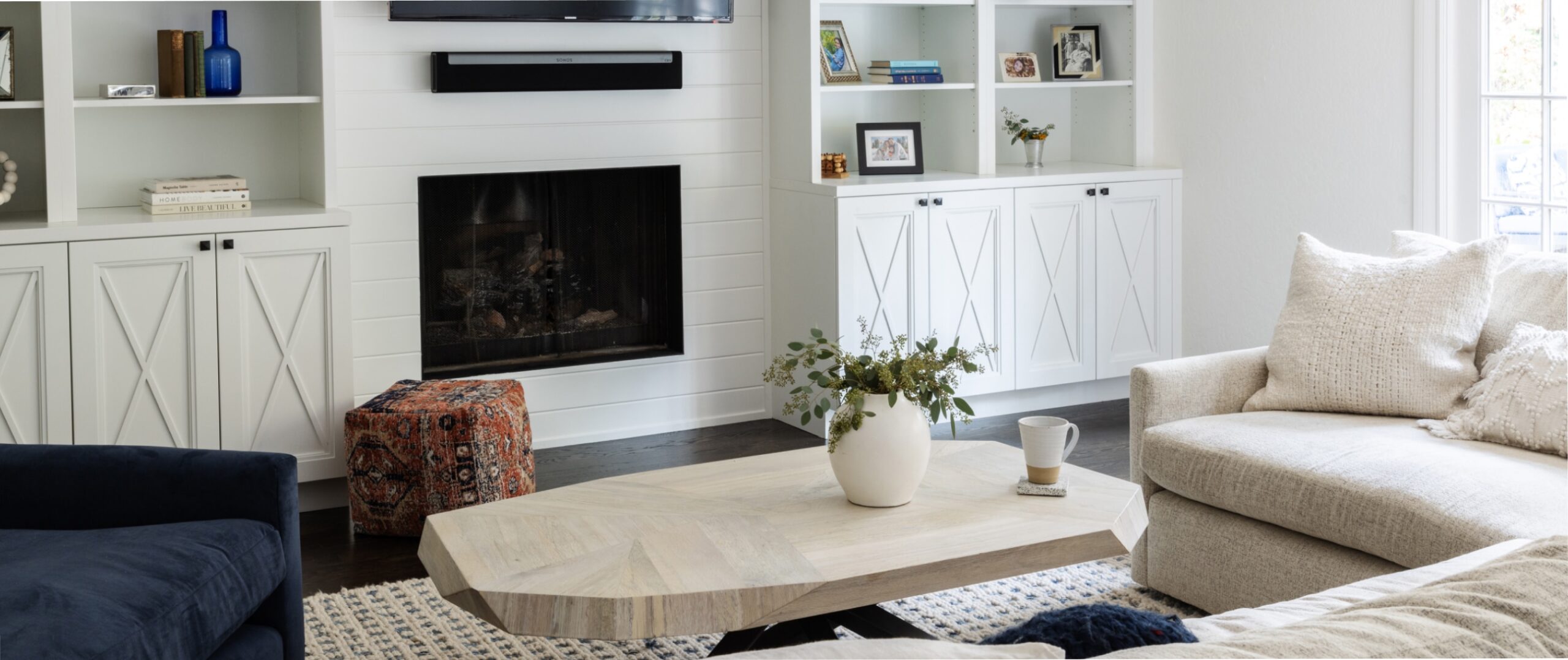 Modern white living room with a modern wood coffee table