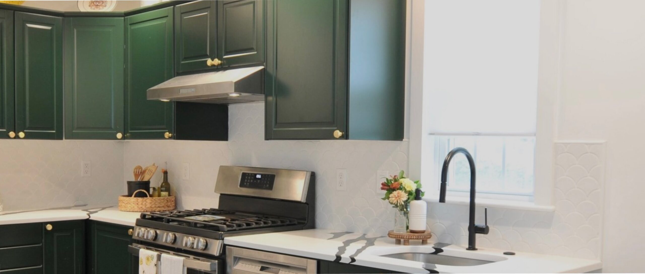 Modern kitchen with green cabinets