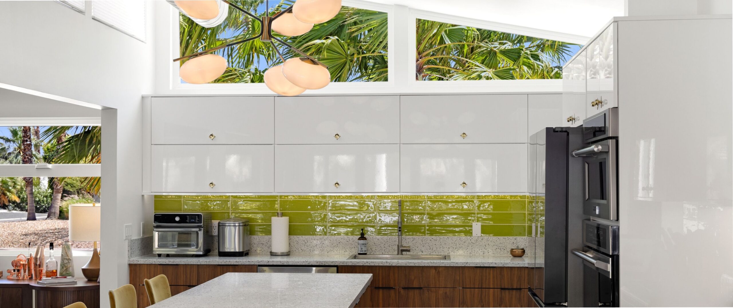 a mid-century style kitchen with a bright green backsplash