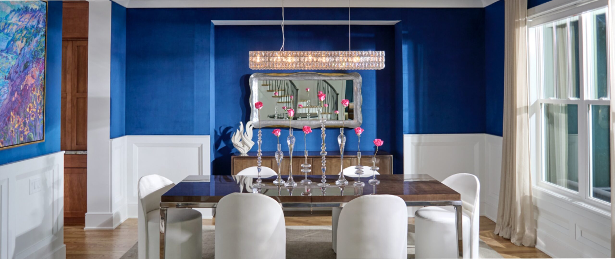 a formal modern dining room with bright blue walls