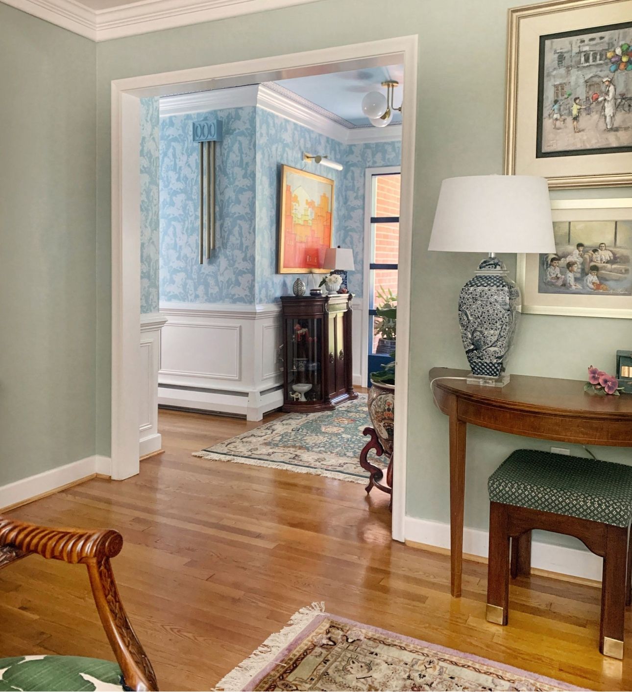 Image of the Entry way makeover by Merh Niazi using the Light Blue Stampede Wallpaper by Milton & King