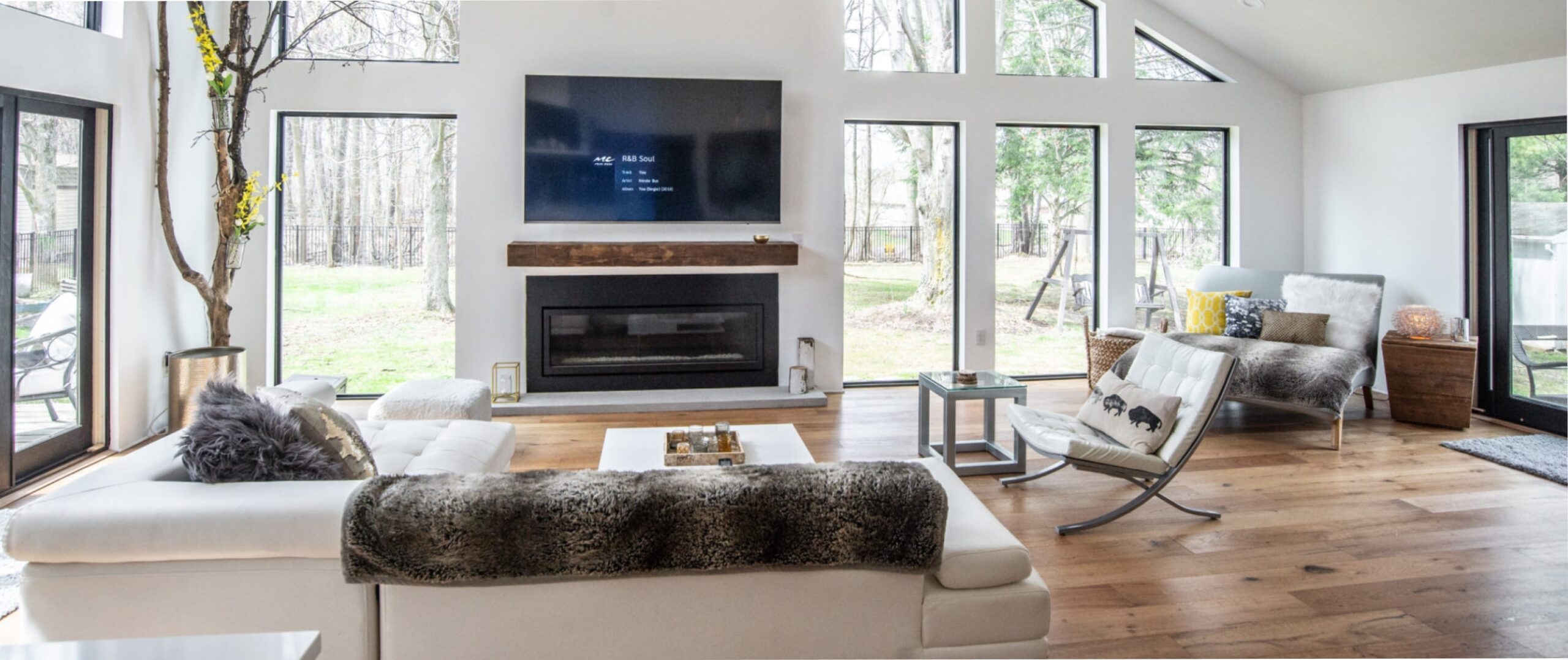 large modern living room with many large windows