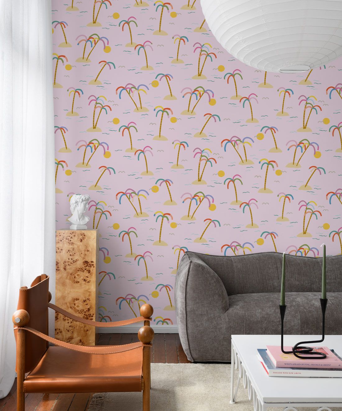 Island style wallpaper with pink background in living room.