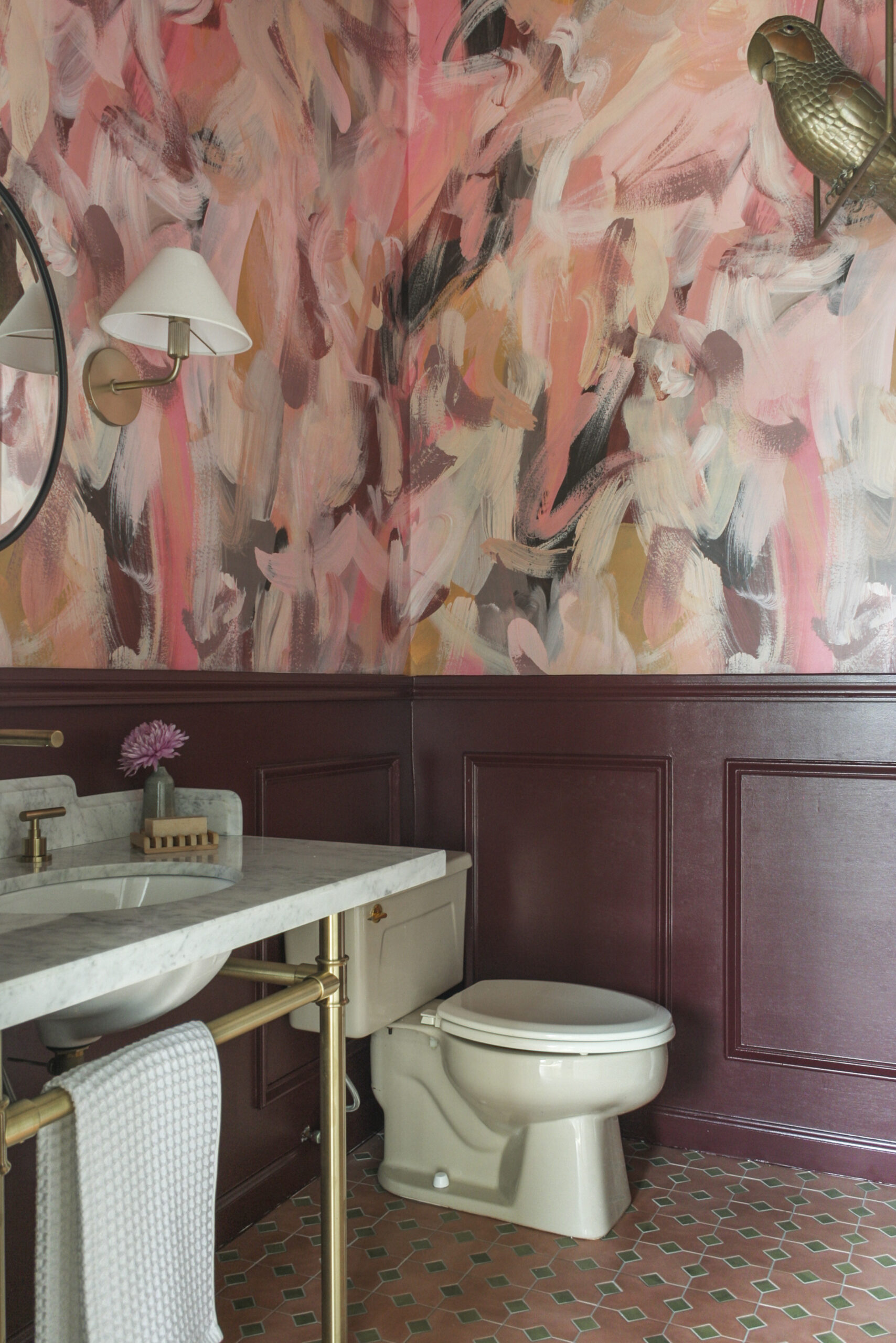 He said She said installed in a bathroom with a Maroon half wall.