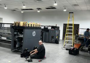 Dale the HP man working on the Dallas Printer