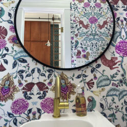 Playful Tiger Wallpaper • White • Powder Room Installation by Mallory Brame with circular black framed mirror