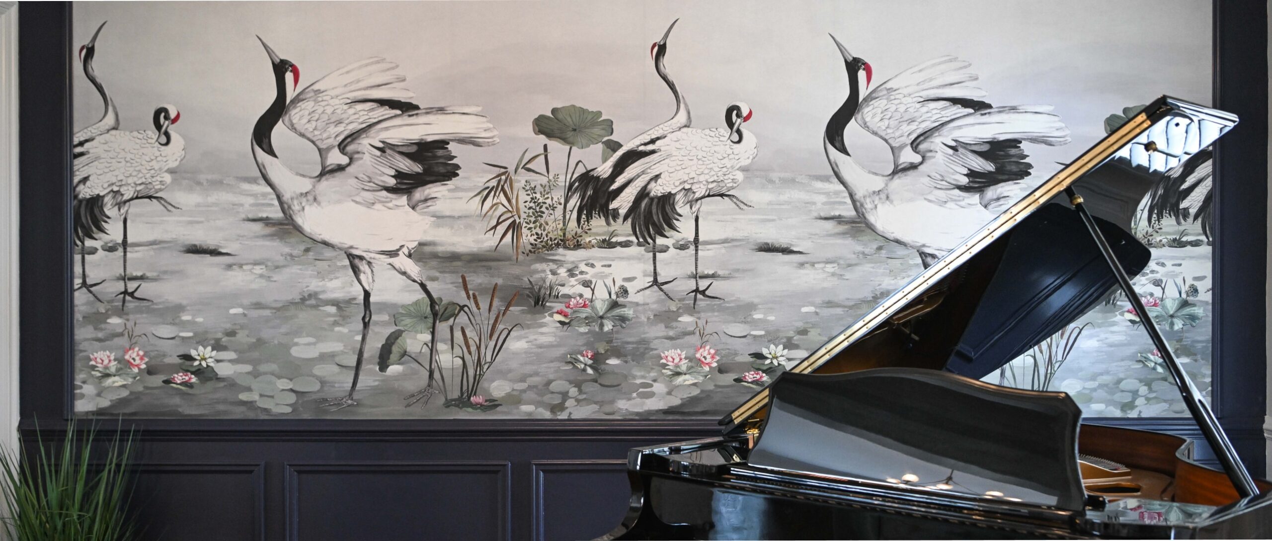 Alex Klein Creative Designs living room with a piano and mural