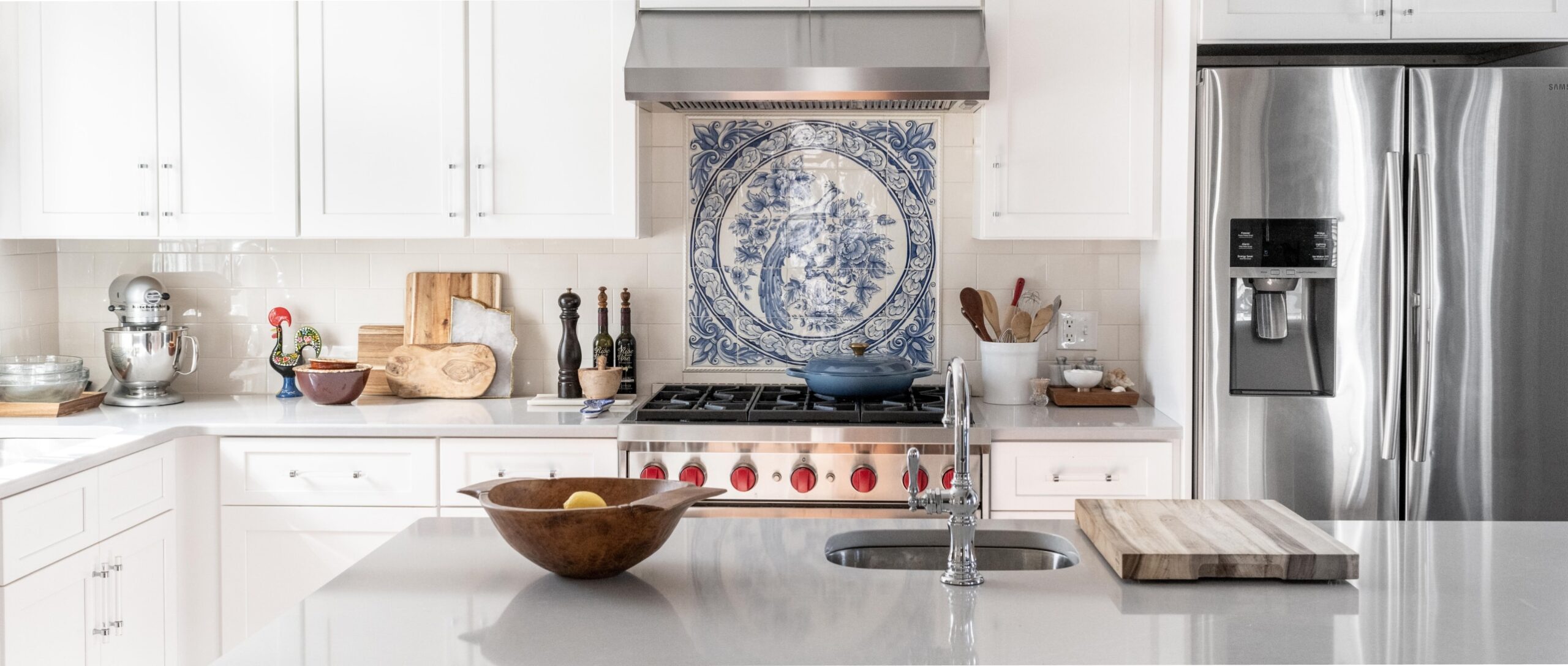Lindsey Dana Designs Kitchen with blue and white tiles