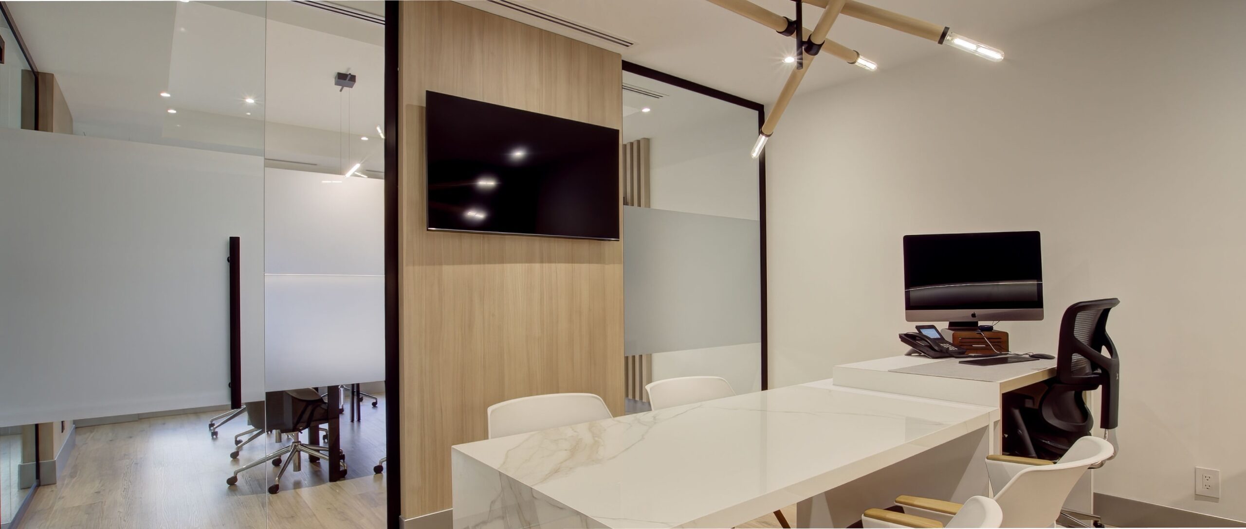 Room Utopia Interiors office room with a tv