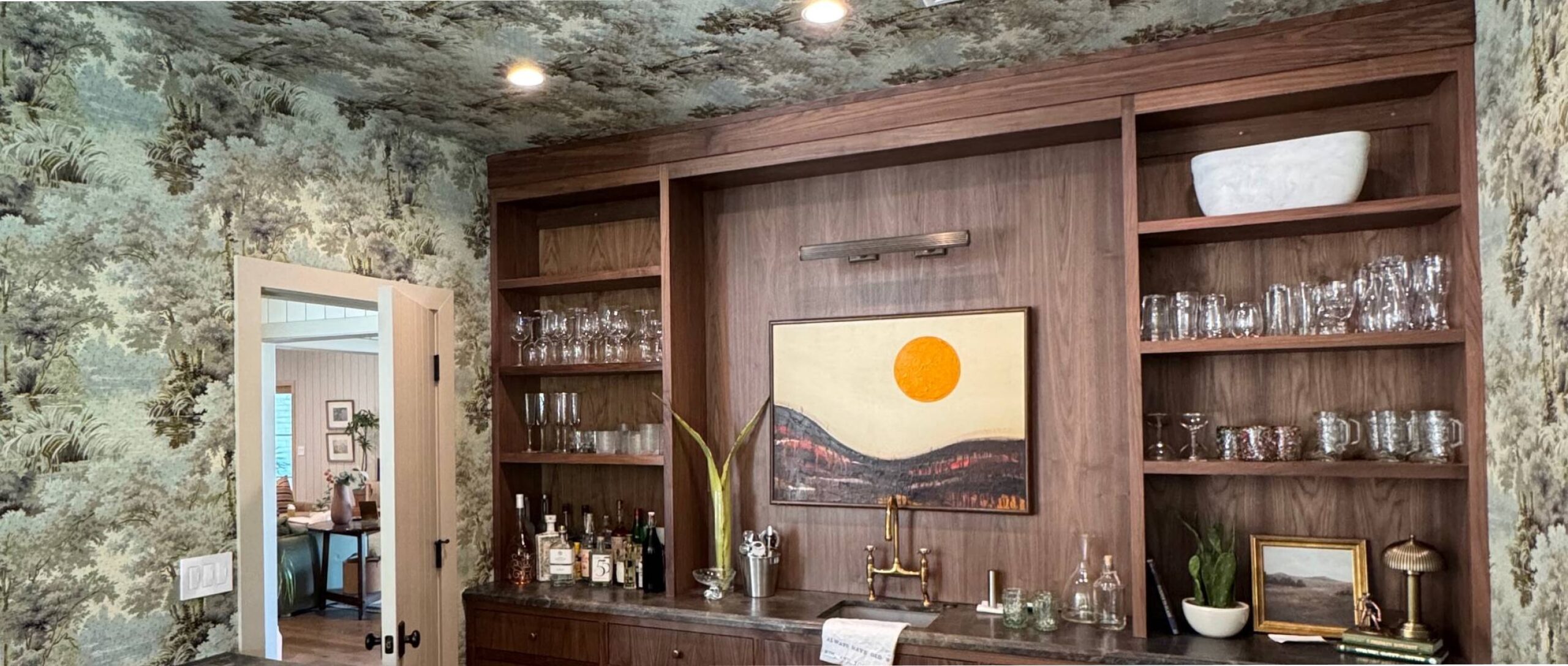 A classic wallpapered bar in a large home