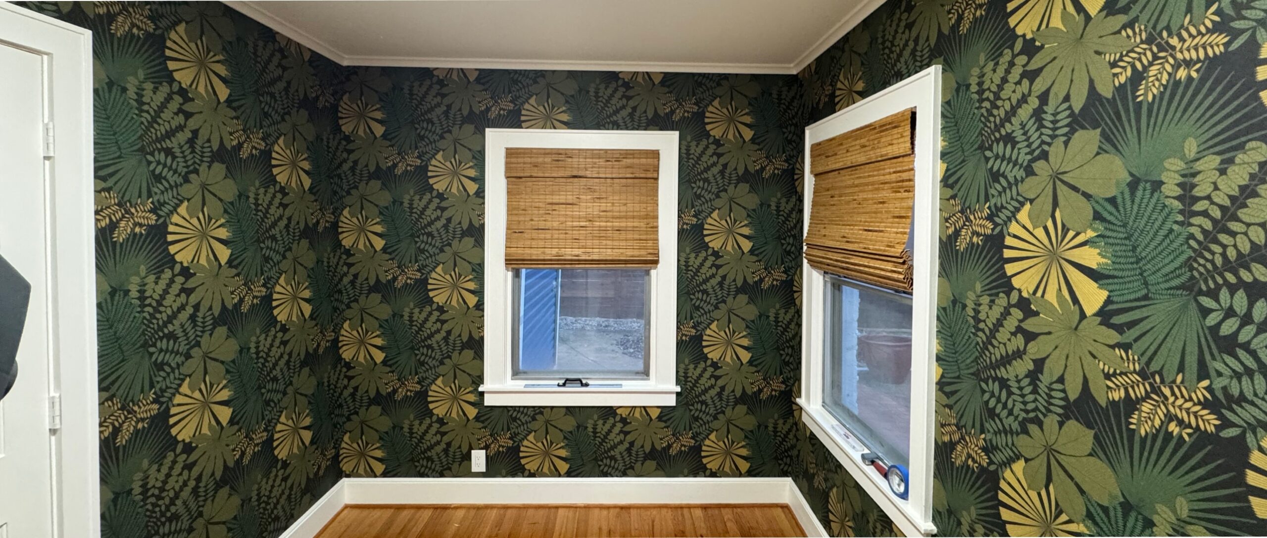 Surface Theory wallpapered green living room