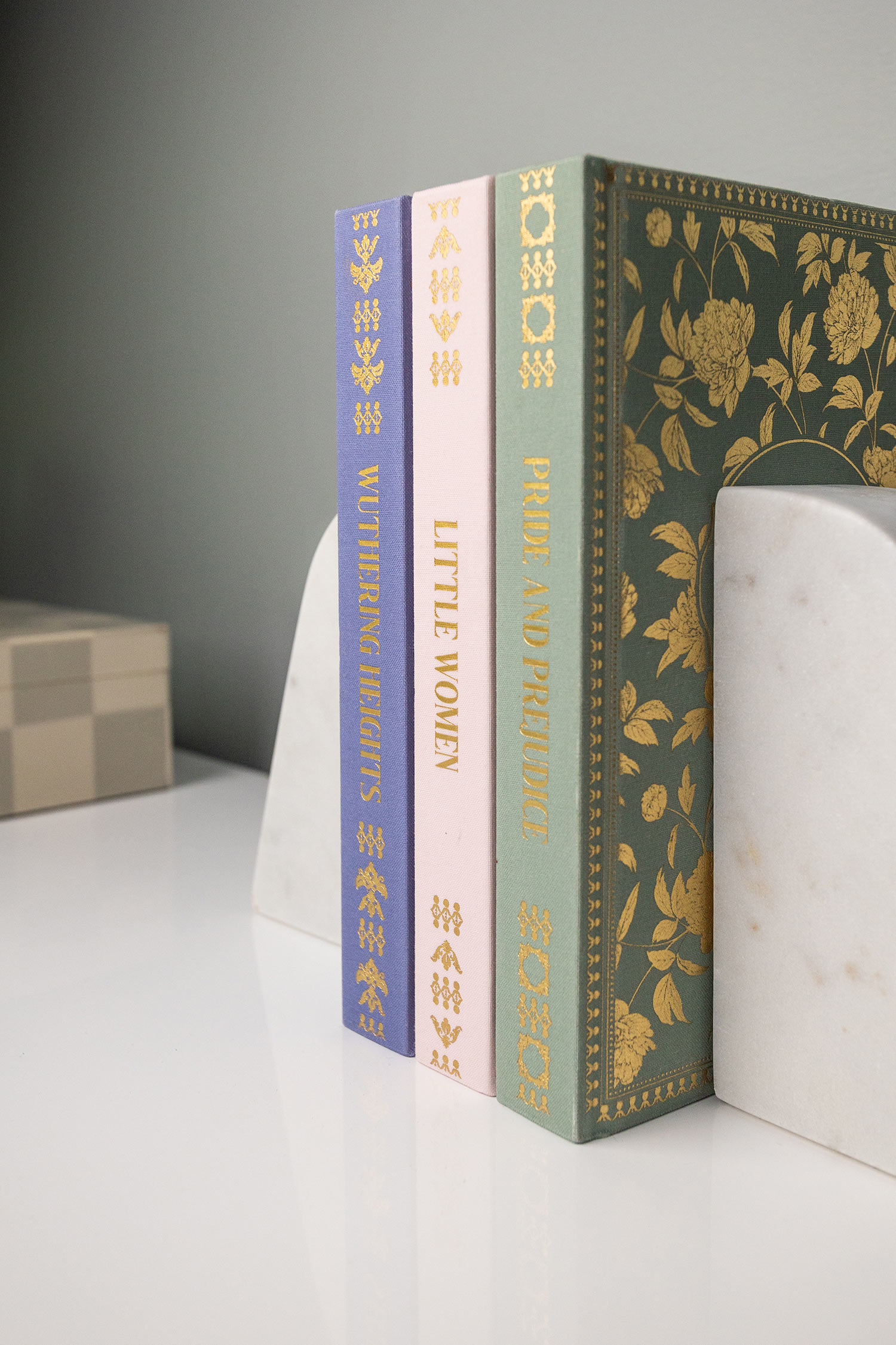 3 books held up by white bookends.