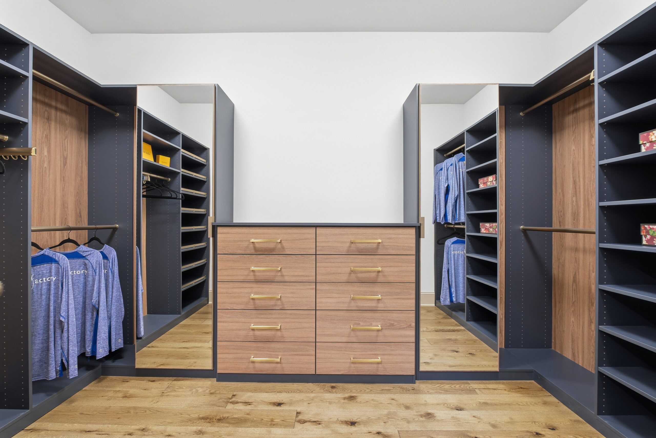 Closet space with dark gray shelving